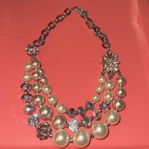 Pink pearl, and clear crystal pendant that can be adjusted to fit your neck.